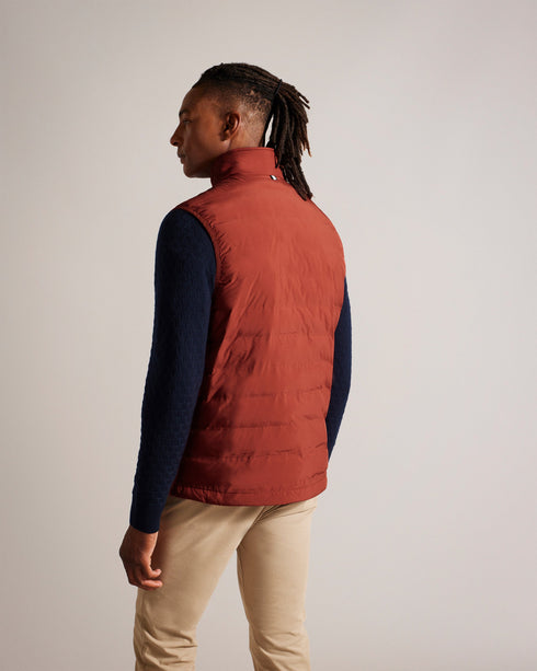 NEWWARK-Outerwear-Say yes to effortless style with the NEWWARK gilet. A gilet is the perfect lightweight coverup for warmer weather and this one's funnel neck and padding keep out the breeze. Gilet Pockets Zip fastening Funnel neck Padded Magnolia label- Ted Baker Romania